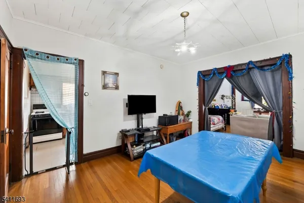 a living room with furniture a rug and a flat screen tv