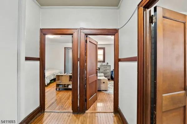 a view of a bathroom from a corridor