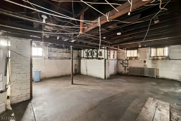 a view of empty room with wooden ceiling