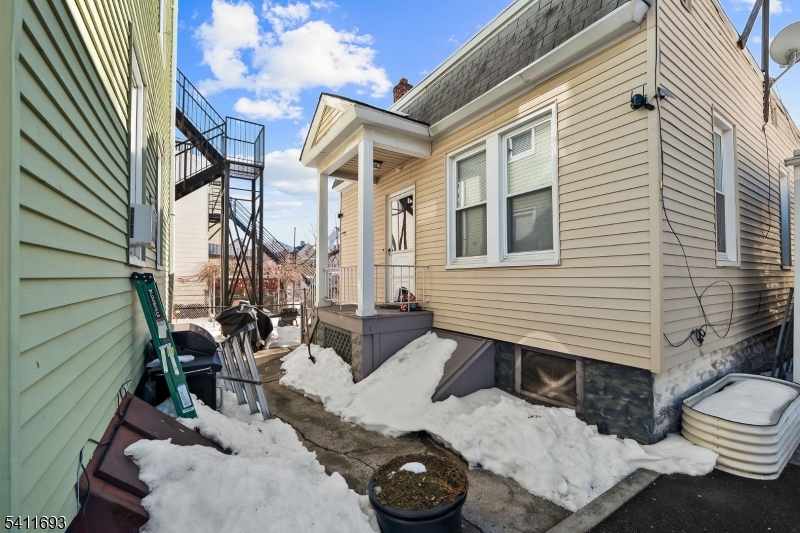 419 Hamilton Street Harrison, NJ 07029 - Photo 30 of 42 a view of a patio with chair and tables back yard of the house