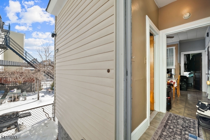 419 Hamilton Street Harrison, NJ 07029 - Photo 31 of 42 a view of a balcony and a yard