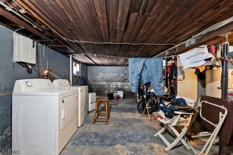 419 Hamilton Street Harrison, NJ 07029 - Photo 42 of 42 a view of a storage room with washer and dryer