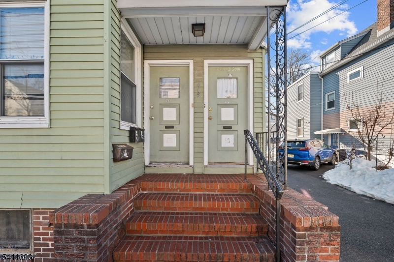 419 Hamilton Street Harrison, NJ 07029 - Photo 5 of 42 a front view of a house with a outdoor space