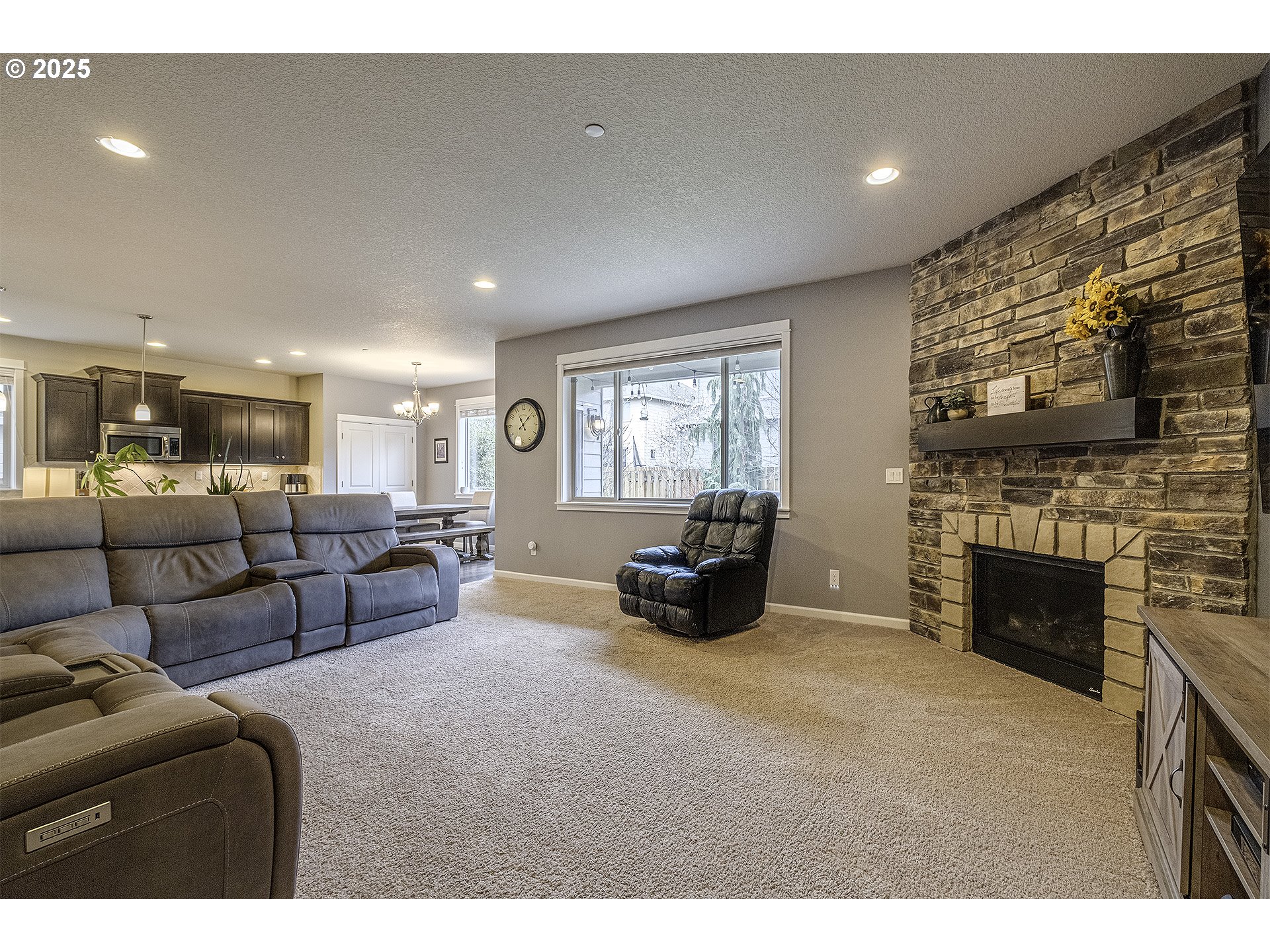 22831 Southwest Park Row Sherwood, OR 97140 - Photo 11 of 33 a living room with furniture and a fireplace