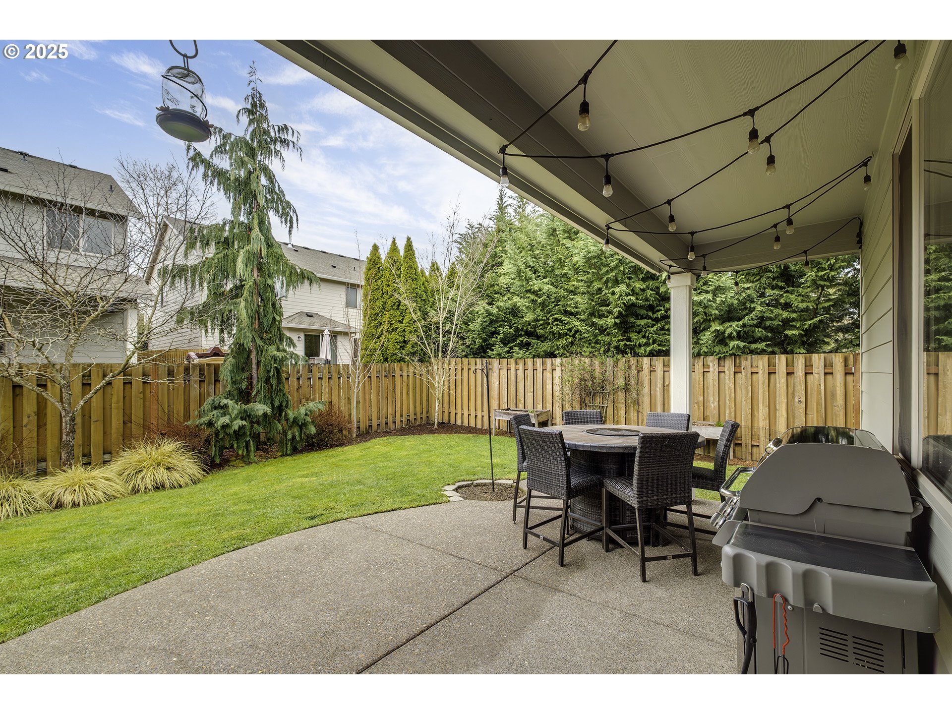 22831 Southwest Park Row Sherwood, OR 97140 - Photo 24 of 33 a backyard of a house with table and chairs
