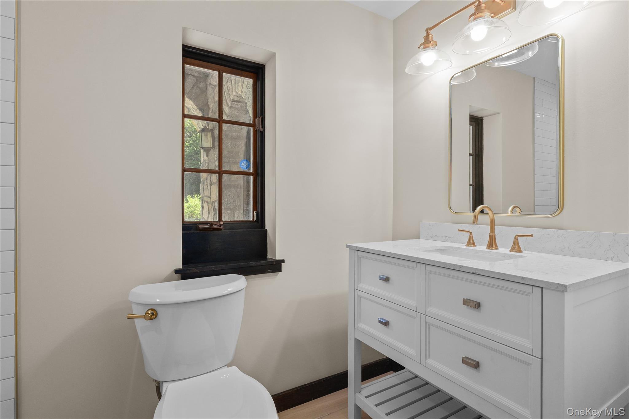 160 Long Ridge Road Bedford, NY 10506 - Photo 15 of 25 a bathroom with a toilet a sink and mirror