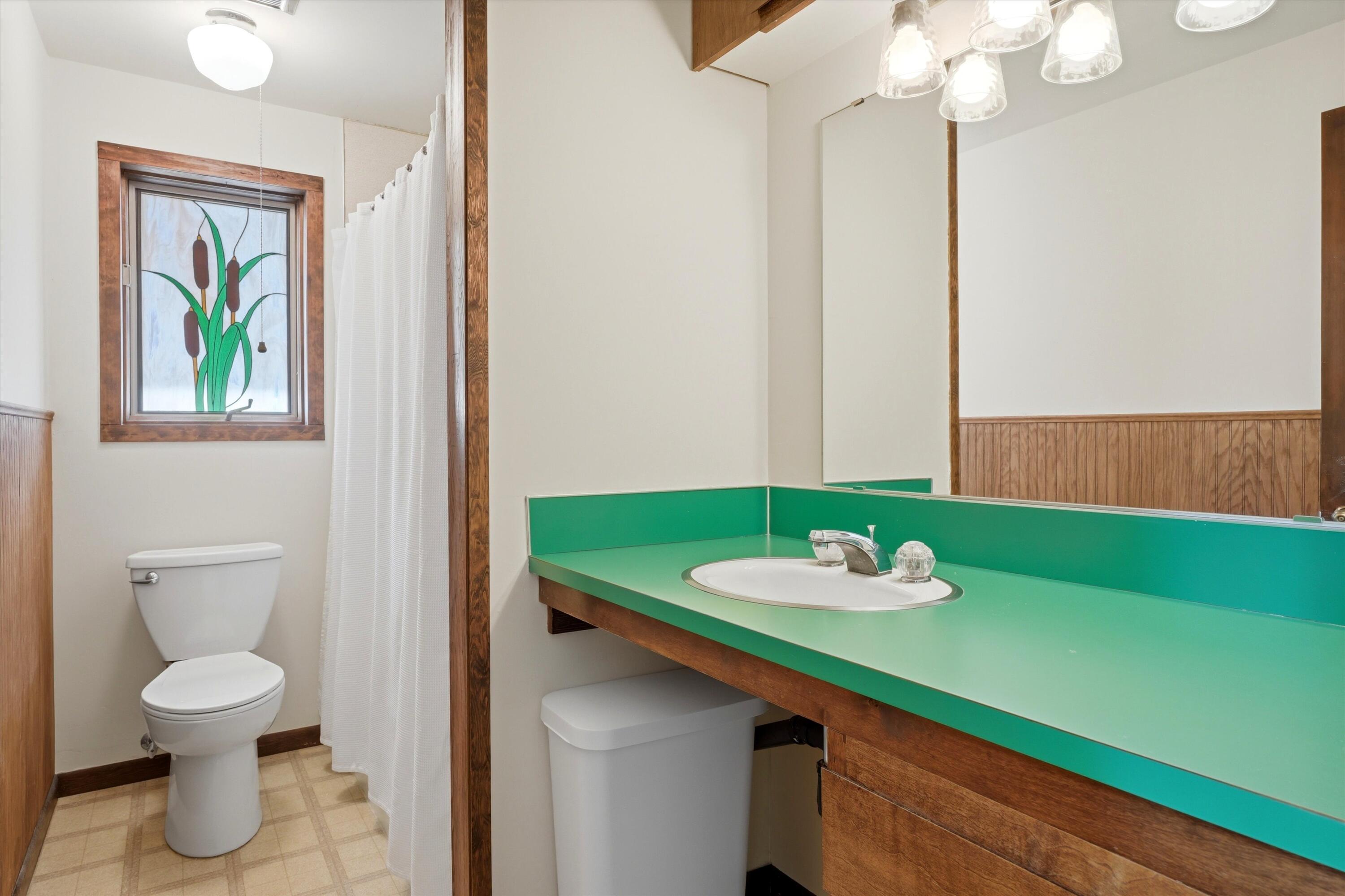 56446 Eclipse Drive Bend, OR 97707 - Photo 32 of 42 a bathroom with a sink and a mirror with toilet