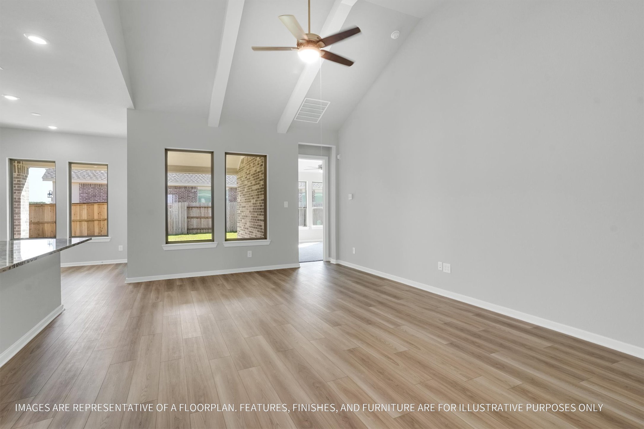 719 Mockingbird Psge Drive Beasley, TX 77417 - Photo 15 of 32 wooden floor in an empty room with a window