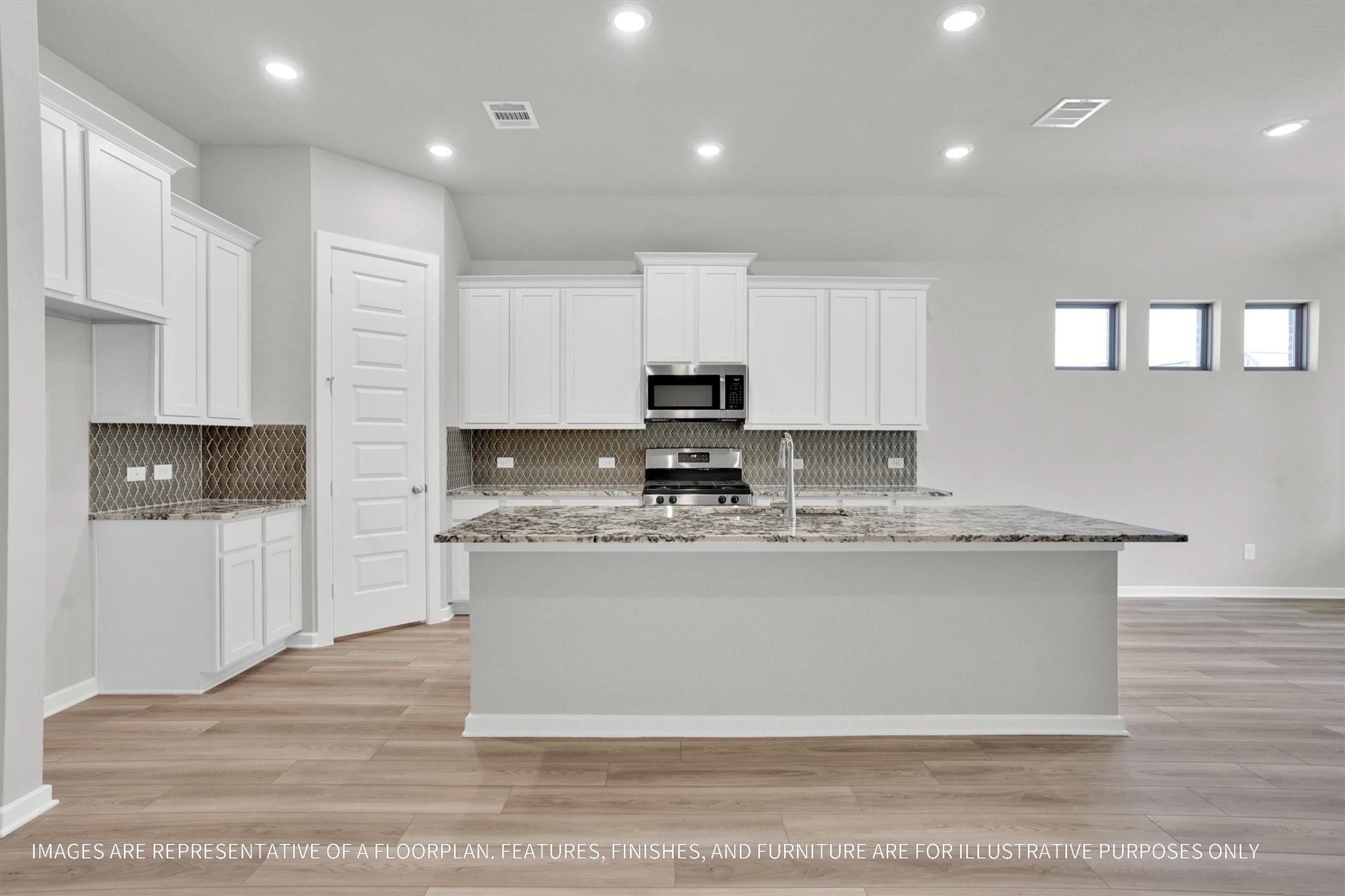 719 Mockingbird Psge Drive Beasley, TX 77417 - Photo 17 of 32 a view of kitchen with stainless steel appliances granite countertop a stove a sink a refrigerator and white cabinets