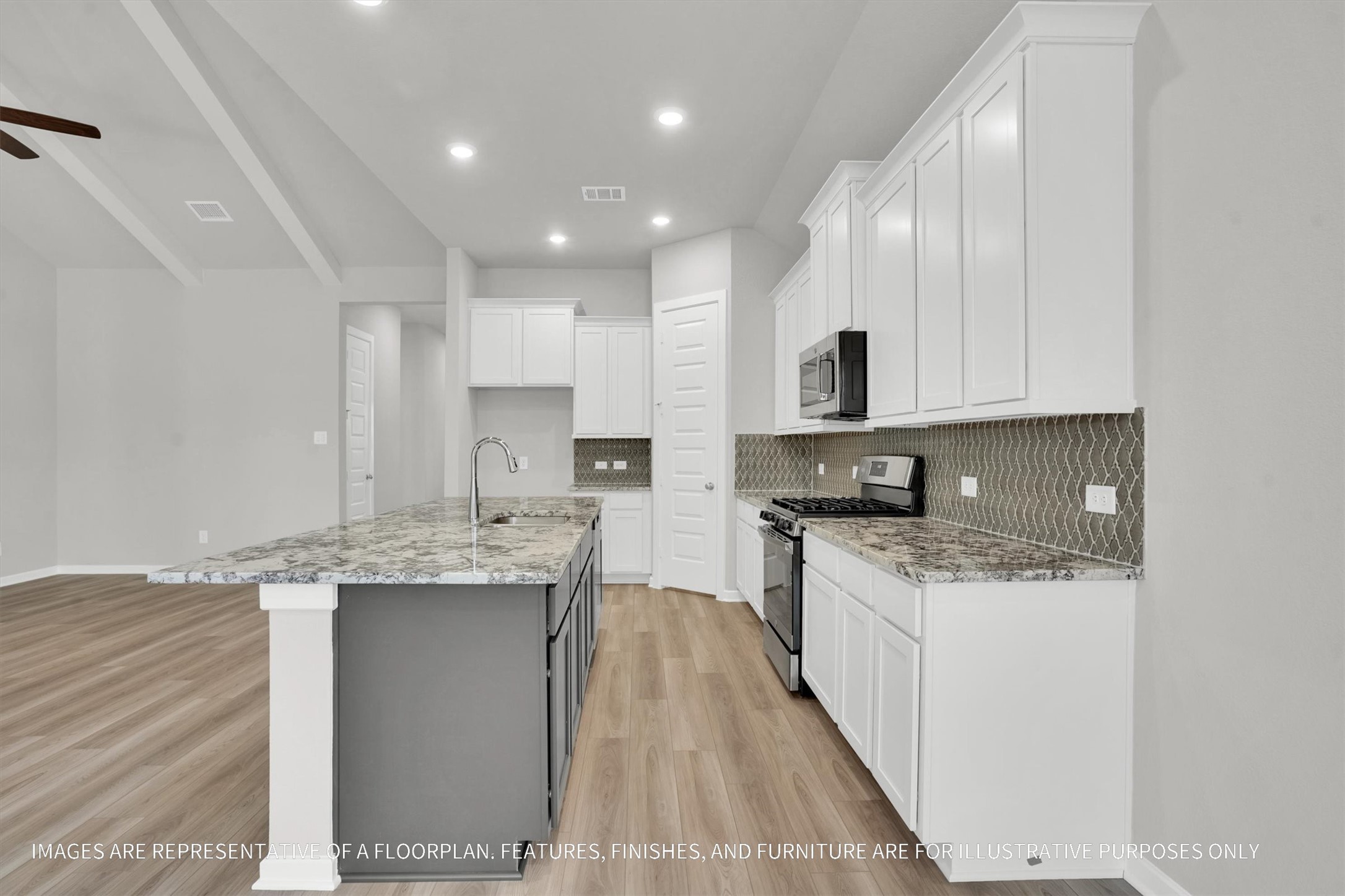 719 Mockingbird Psge Drive Beasley, TX 77417 - Photo 19 of 32 a kitchen with stainless steel appliances granite countertop a sink stove and cabinets