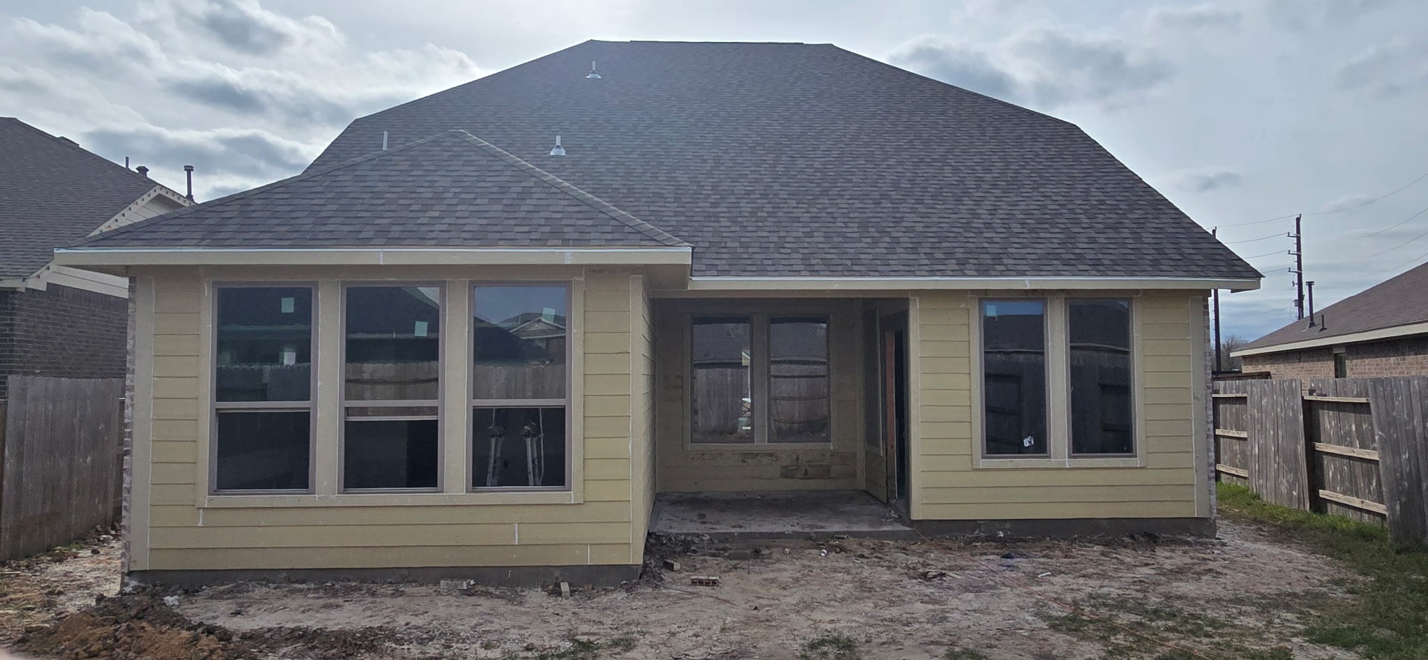 719 Mockingbird Psge Drive Beasley, TX 77417 - Photo 2 of 32 a front view of a house with a garden