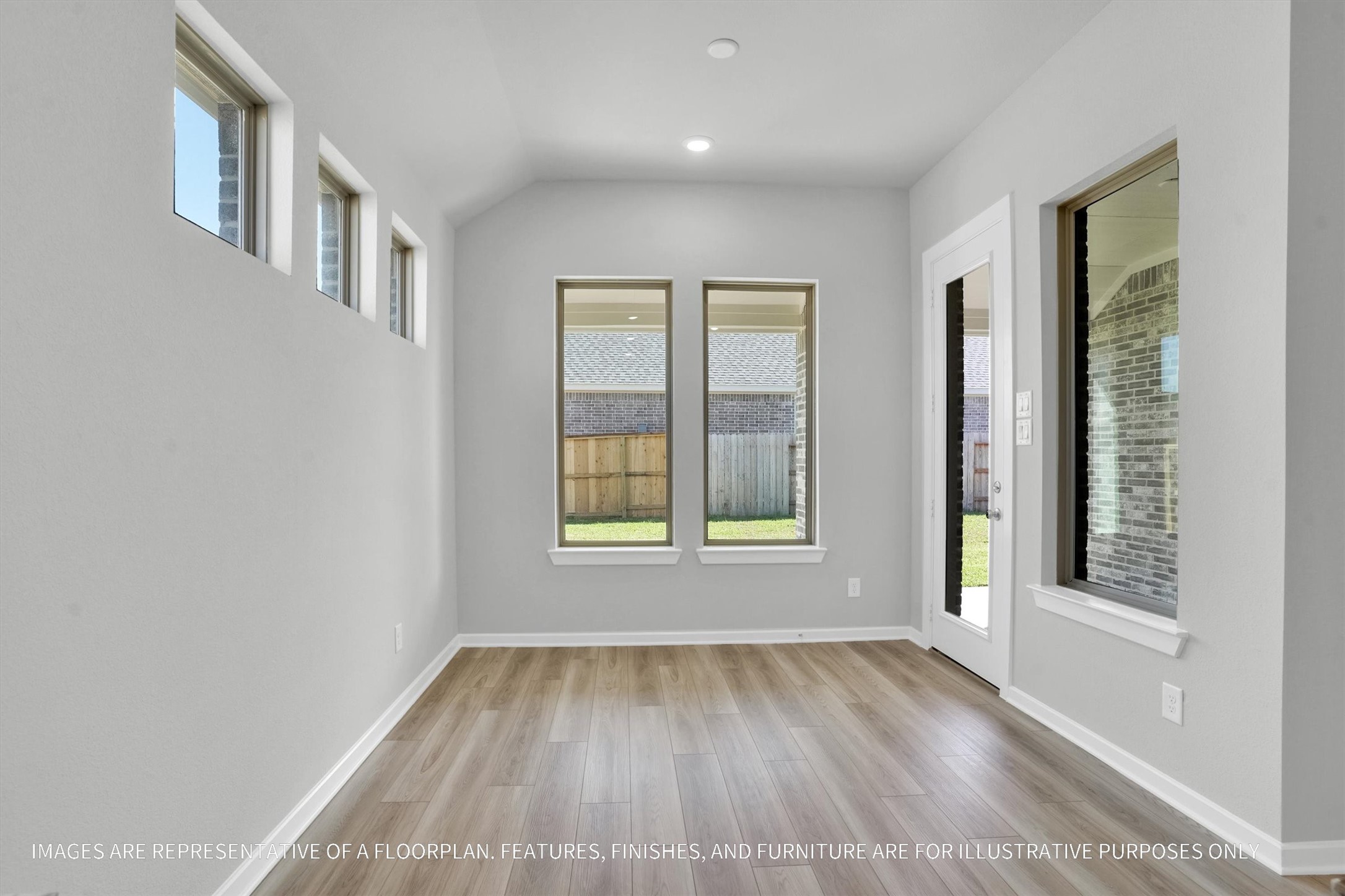 719 Mockingbird Psge Drive Beasley, TX 77417 - Photo 23 of 32 wooden floor in an empty room with a window