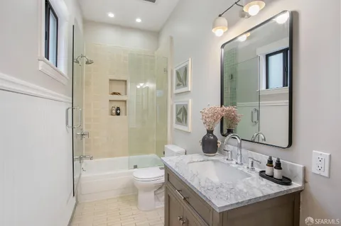 a kitchen with stainless steel appliances granite countertop a stove a refrigerator and a stove