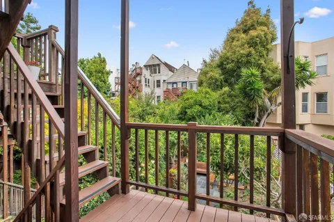 a view of a patio with chairs and a table
