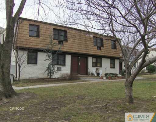 400 Cross Road Matawan, NJ 07747 - Photo 2 of 4 a front view of a house with a yard