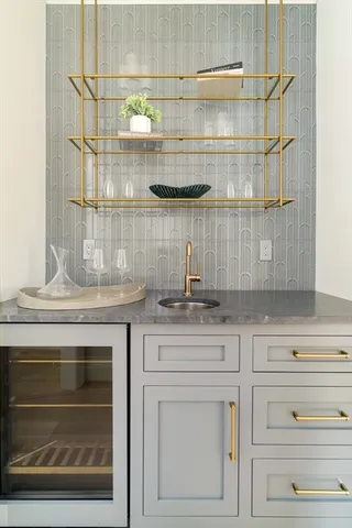 a stove top oven sitting inside of a kitchen