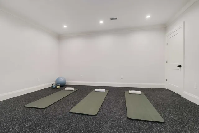 an empty room with a hard wood floor