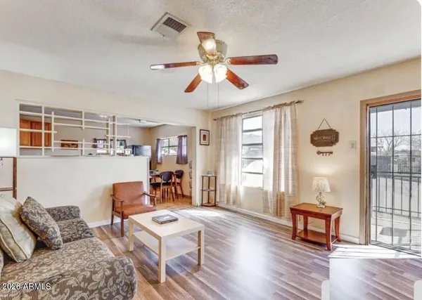 a living room with furniture and a window
