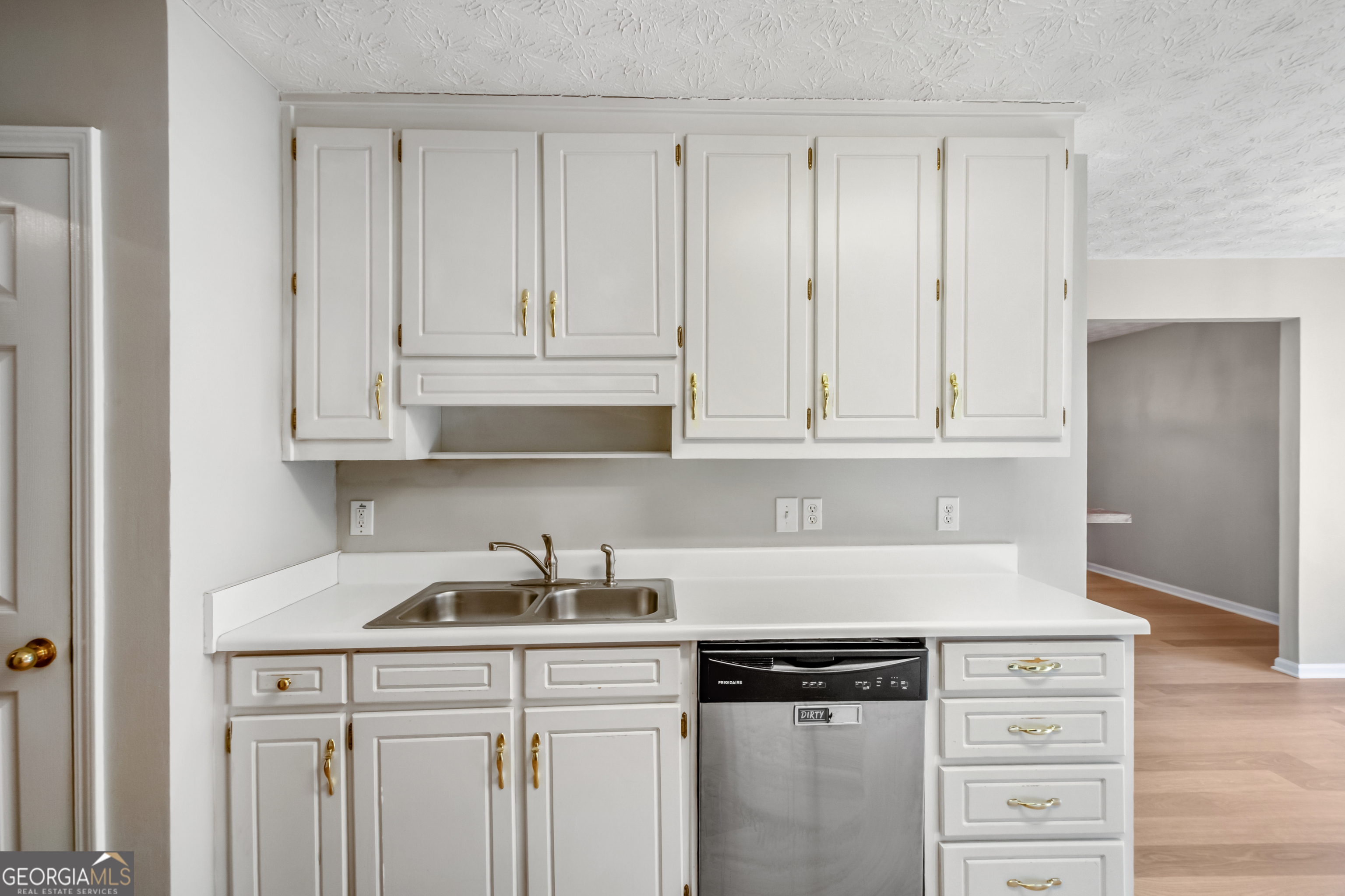953 Azalea Court Winder, GA 30680 - Photo 14 of 56 a kitchen with white cabinets and sink