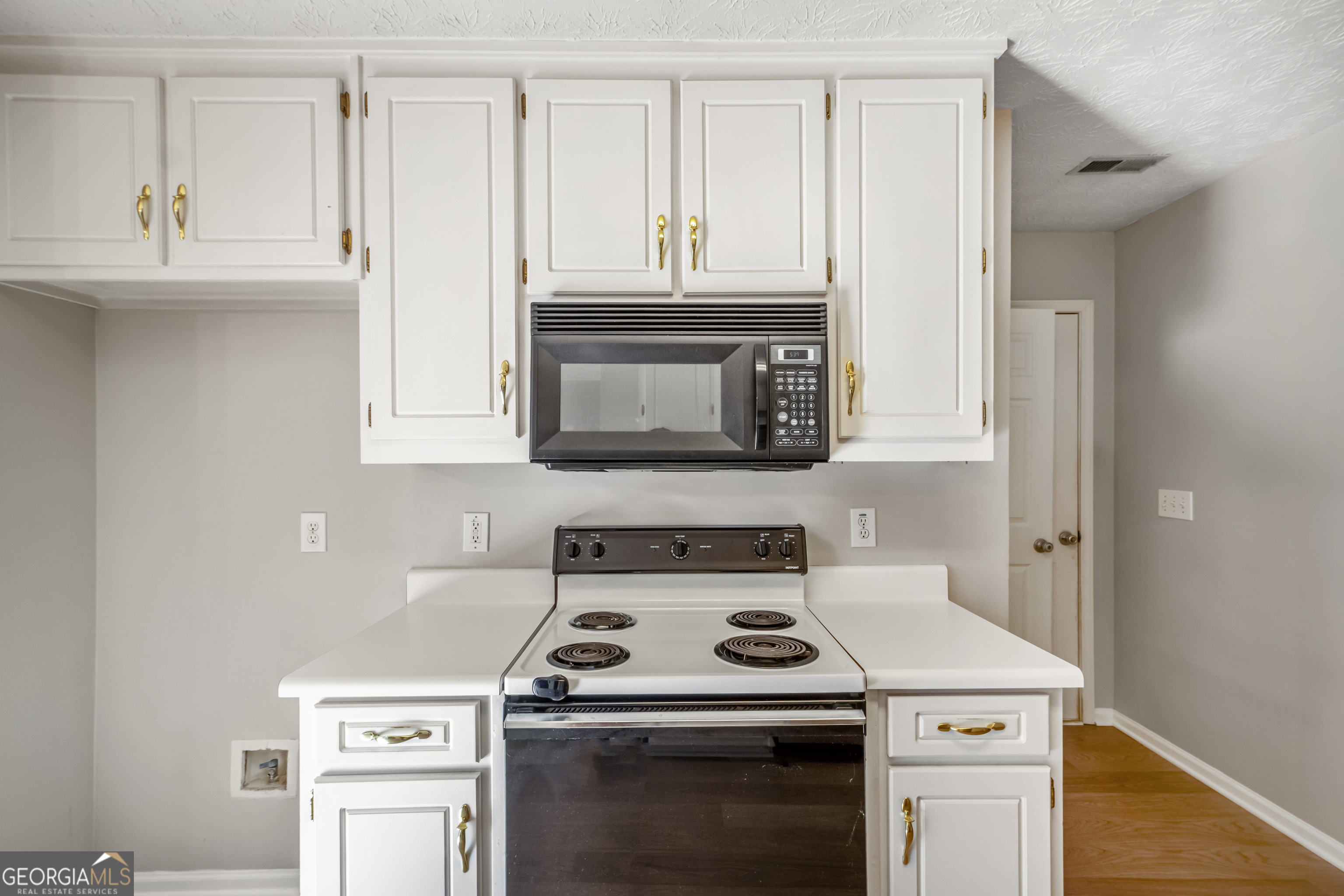 953 Azalea Court Winder, GA 30680 - Photo 15 of 56 a stove top oven sitting inside of a kitchen