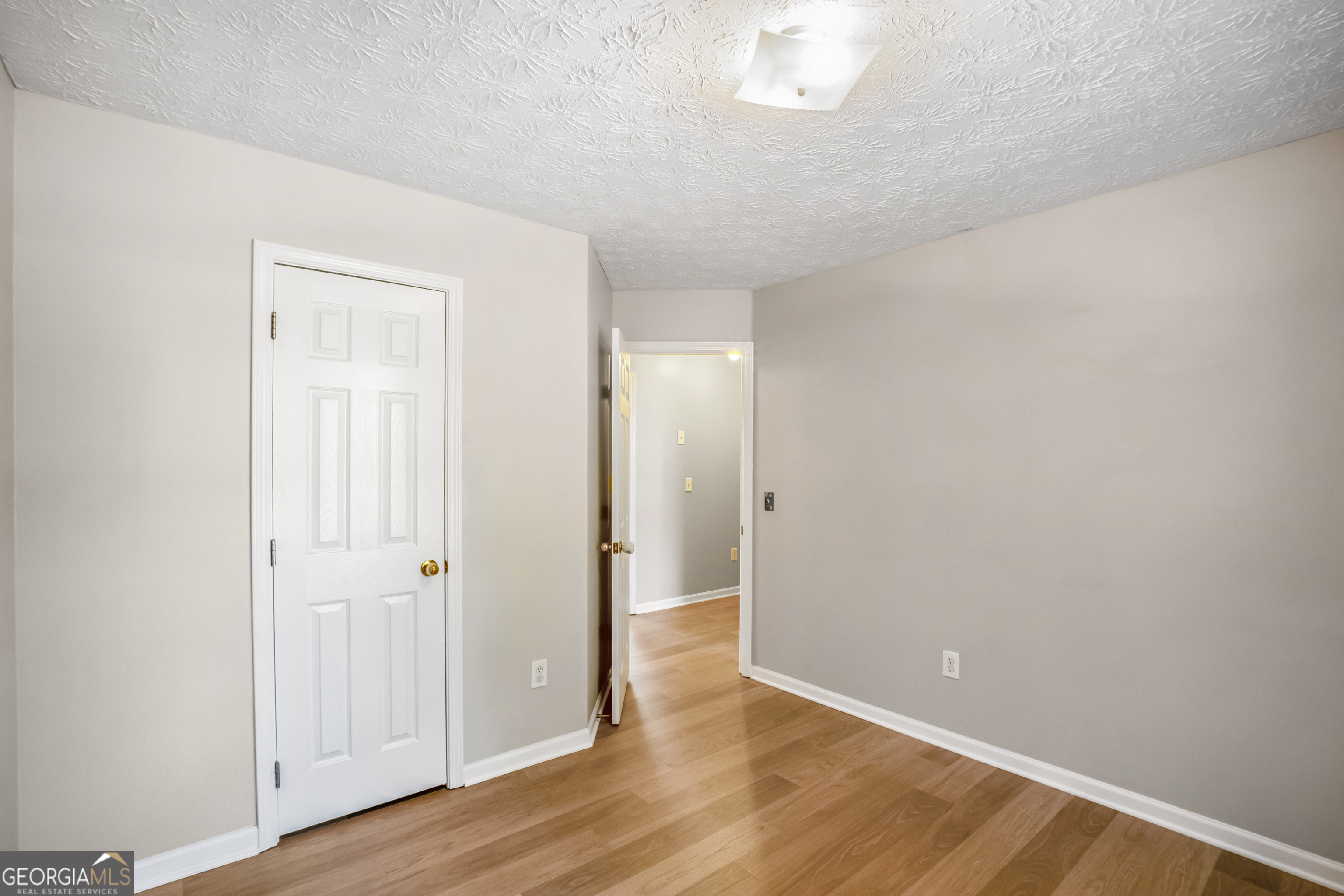 953 Azalea Court Winder, GA 30680 - Photo 19 of 56 a view of an empty room with wooden floor