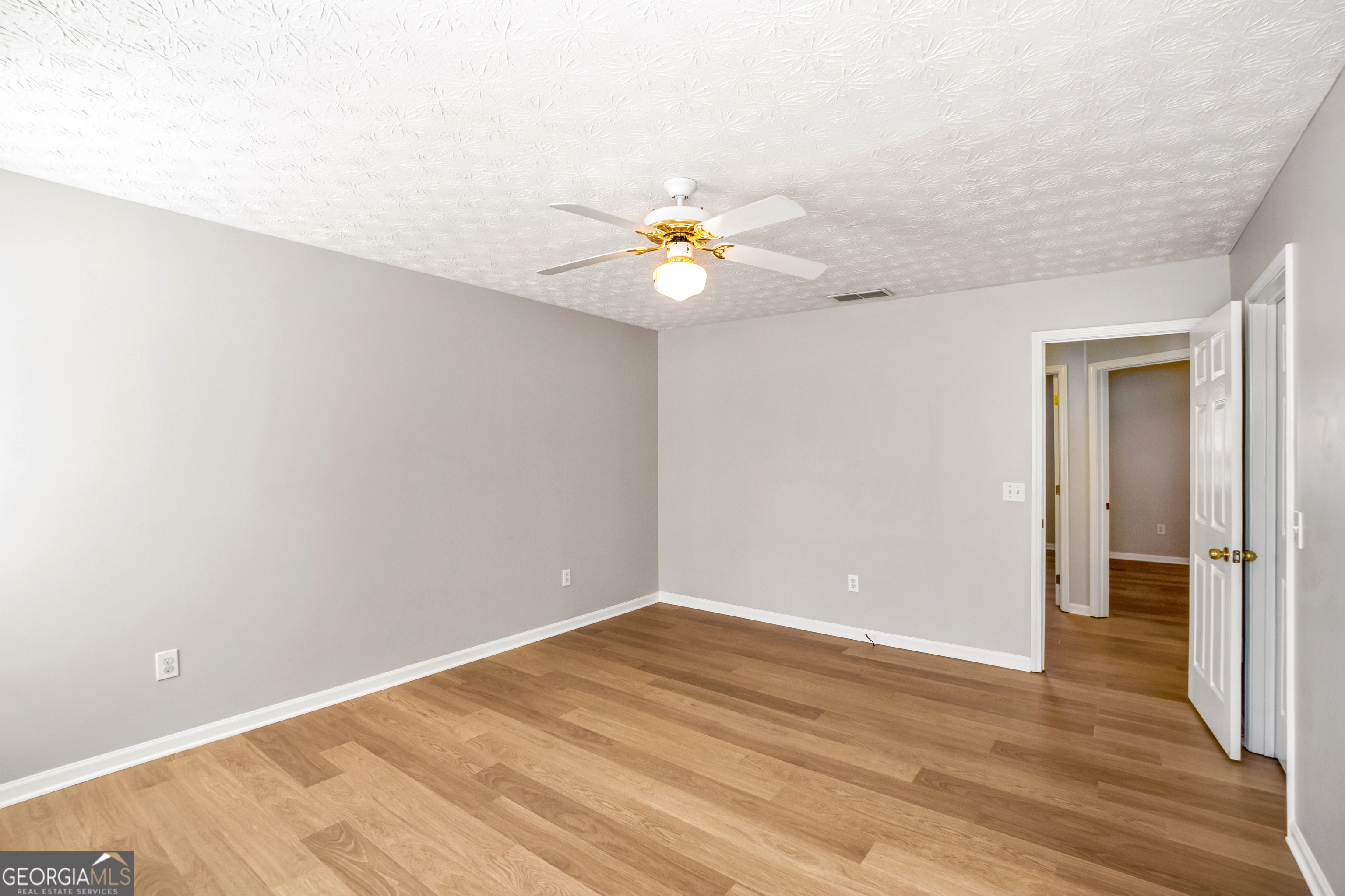 953 Azalea Court Winder, GA 30680 - Photo 22 of 56 wooden floor in an empty room with a window