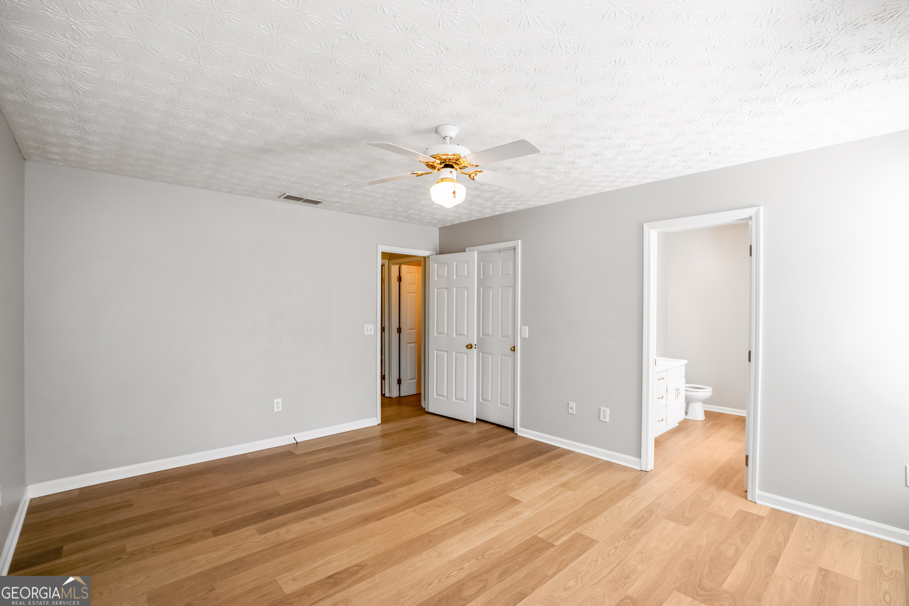 953 Azalea Court Winder, GA 30680 - Photo 23 of 56 a view of an empty room and window and wooden floor