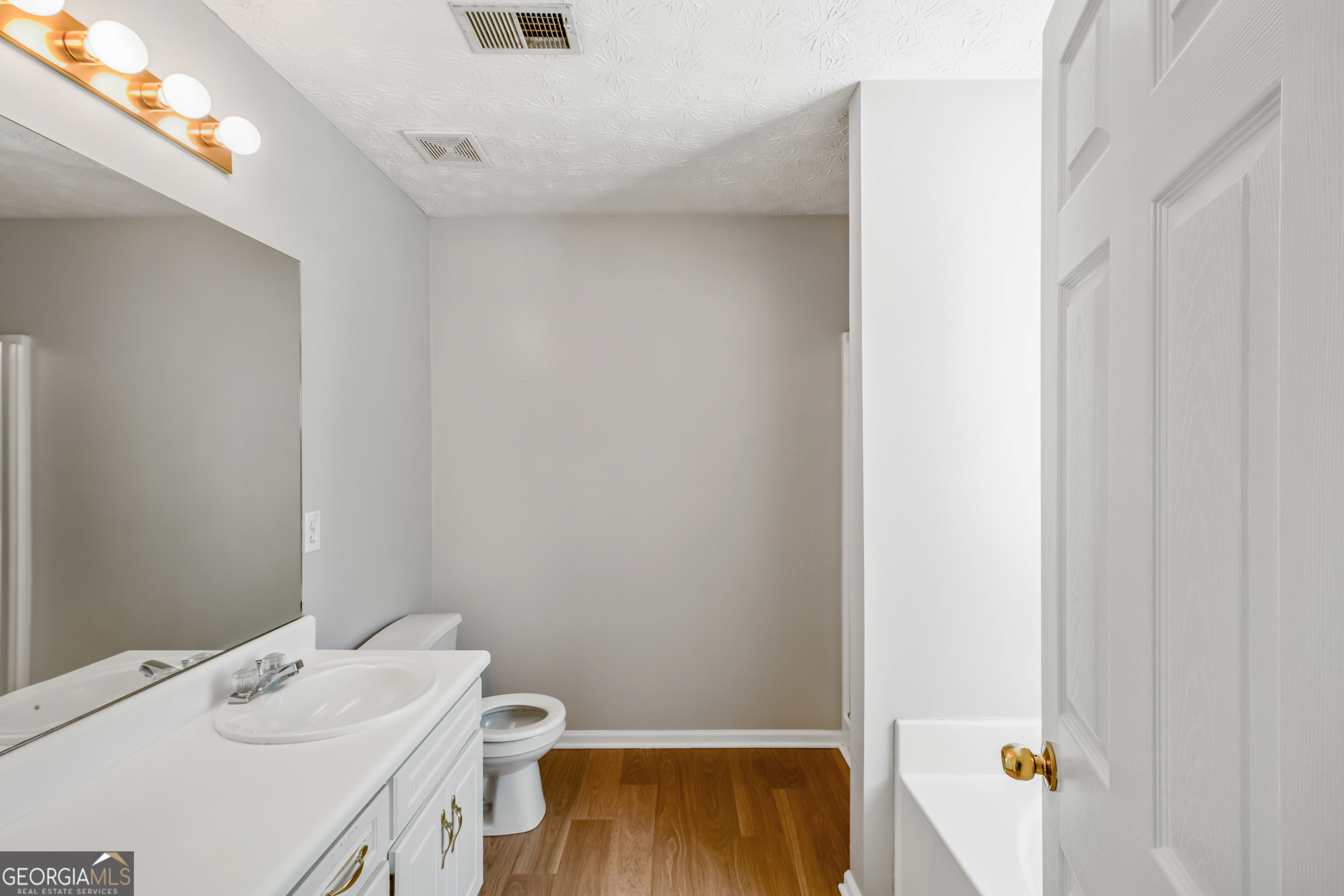 953 Azalea Court Winder, GA 30680 - Photo 24 of 56 a bathroom with a sink toilet and tub