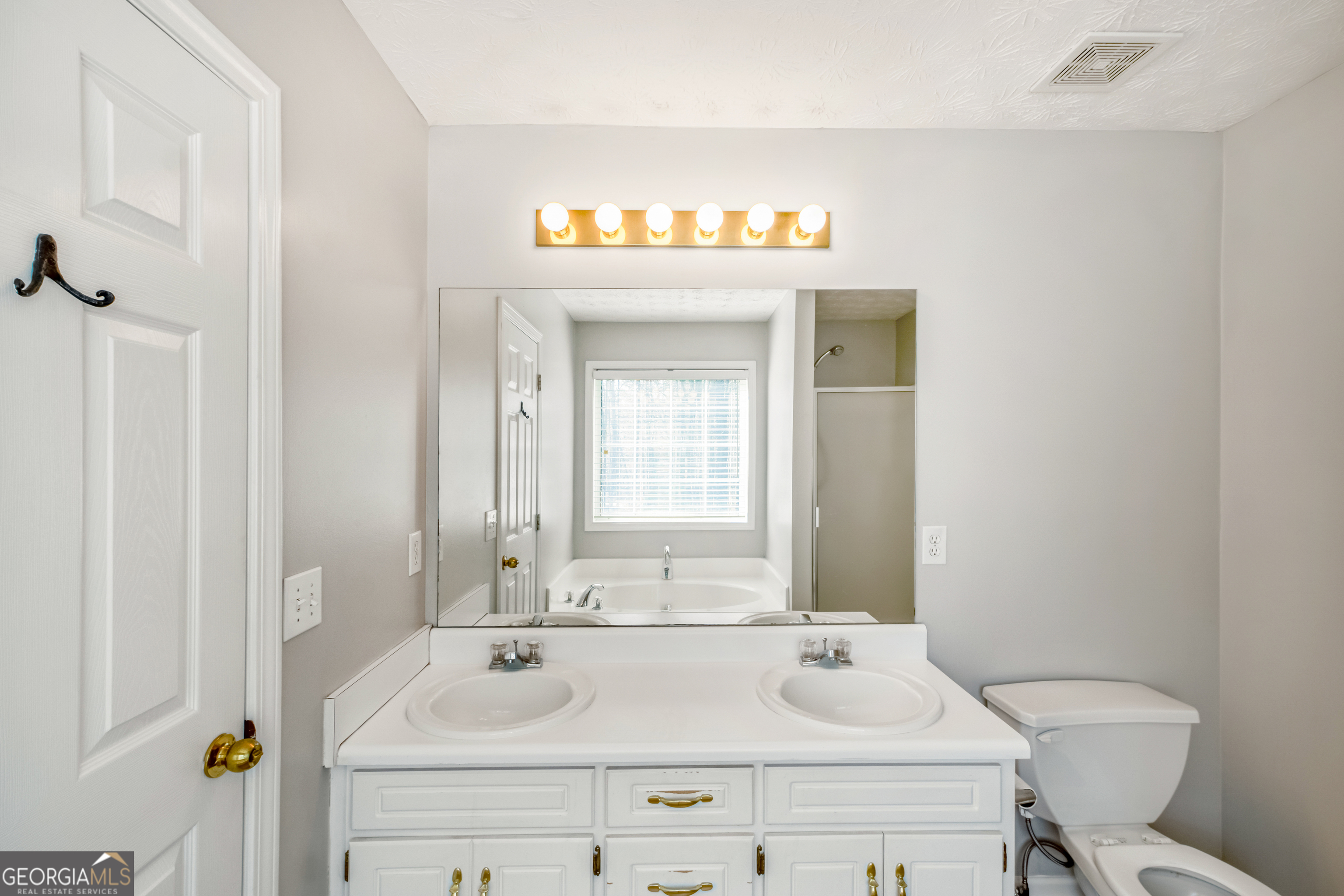 953 Azalea Court Winder, GA 30680 - Photo 25 of 56 a bathroom with a sink and a toilet