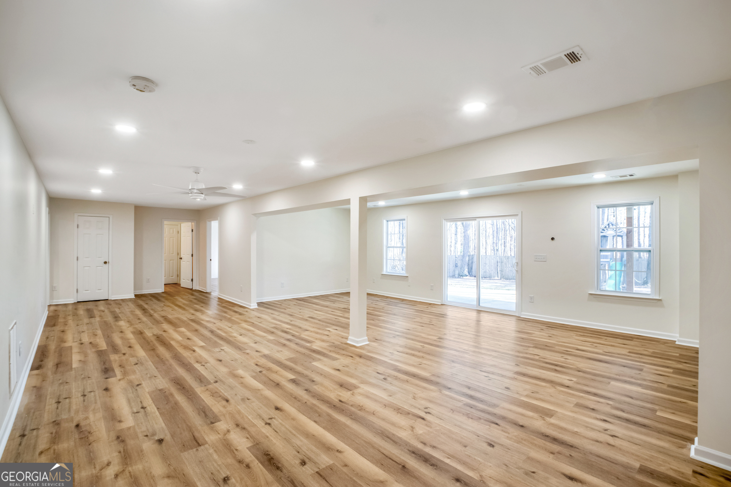 953 Azalea Court Winder, GA 30680 - Photo 29 of 56 a view of an empty room with wooden floor and windows