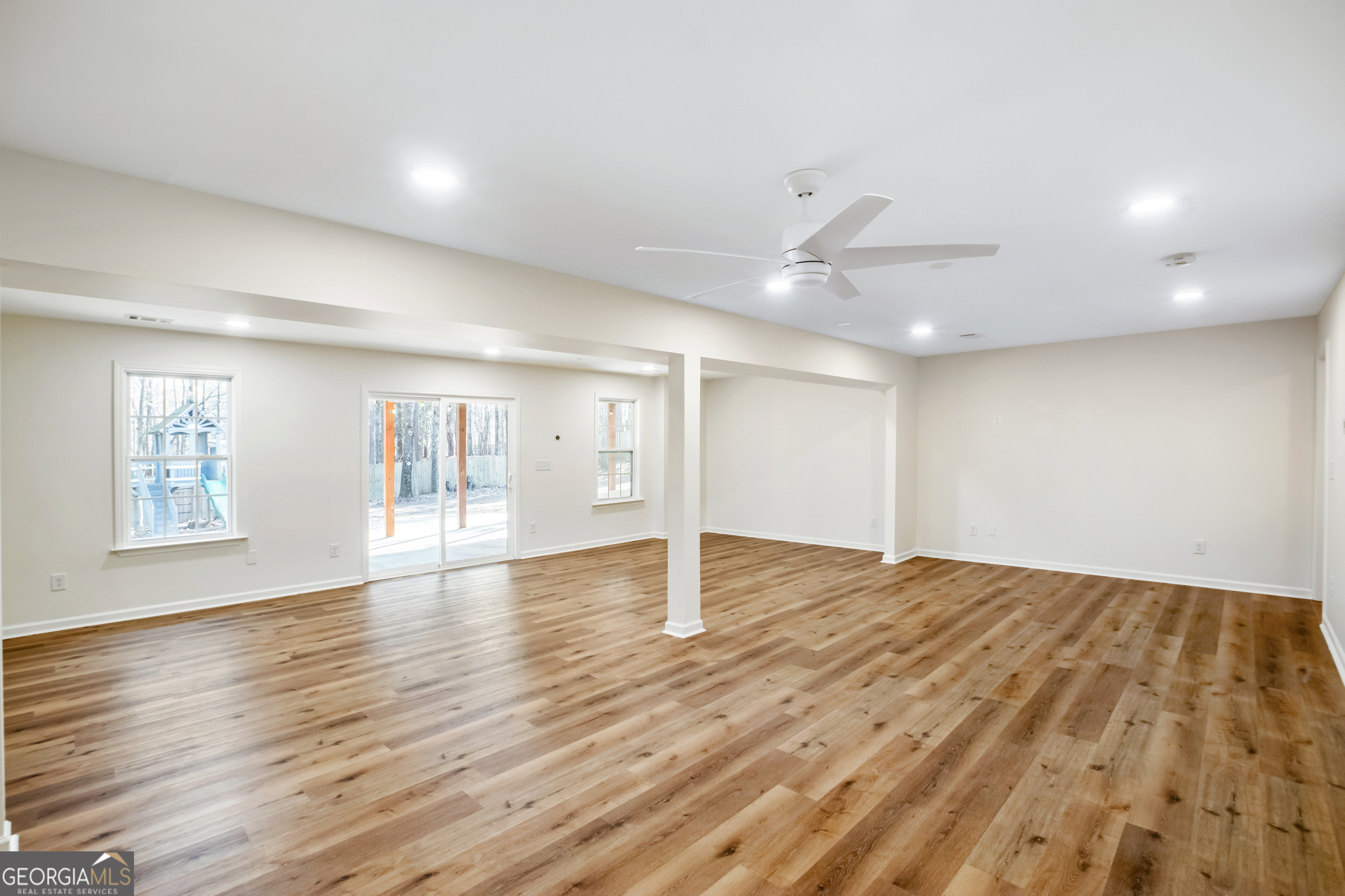 953 Azalea Court Winder, GA 30680 - Photo 32 of 56 a view of an empty room with wooden floor and a window