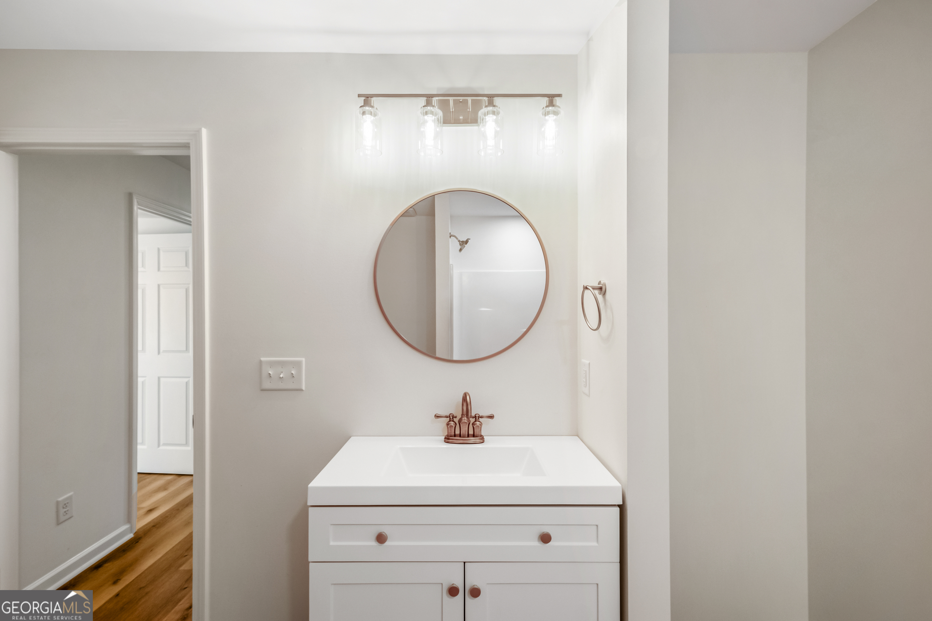 953 Azalea Court Winder, GA 30680 - Photo 36 of 56 a bathroom with a sink a mirror and a toilet