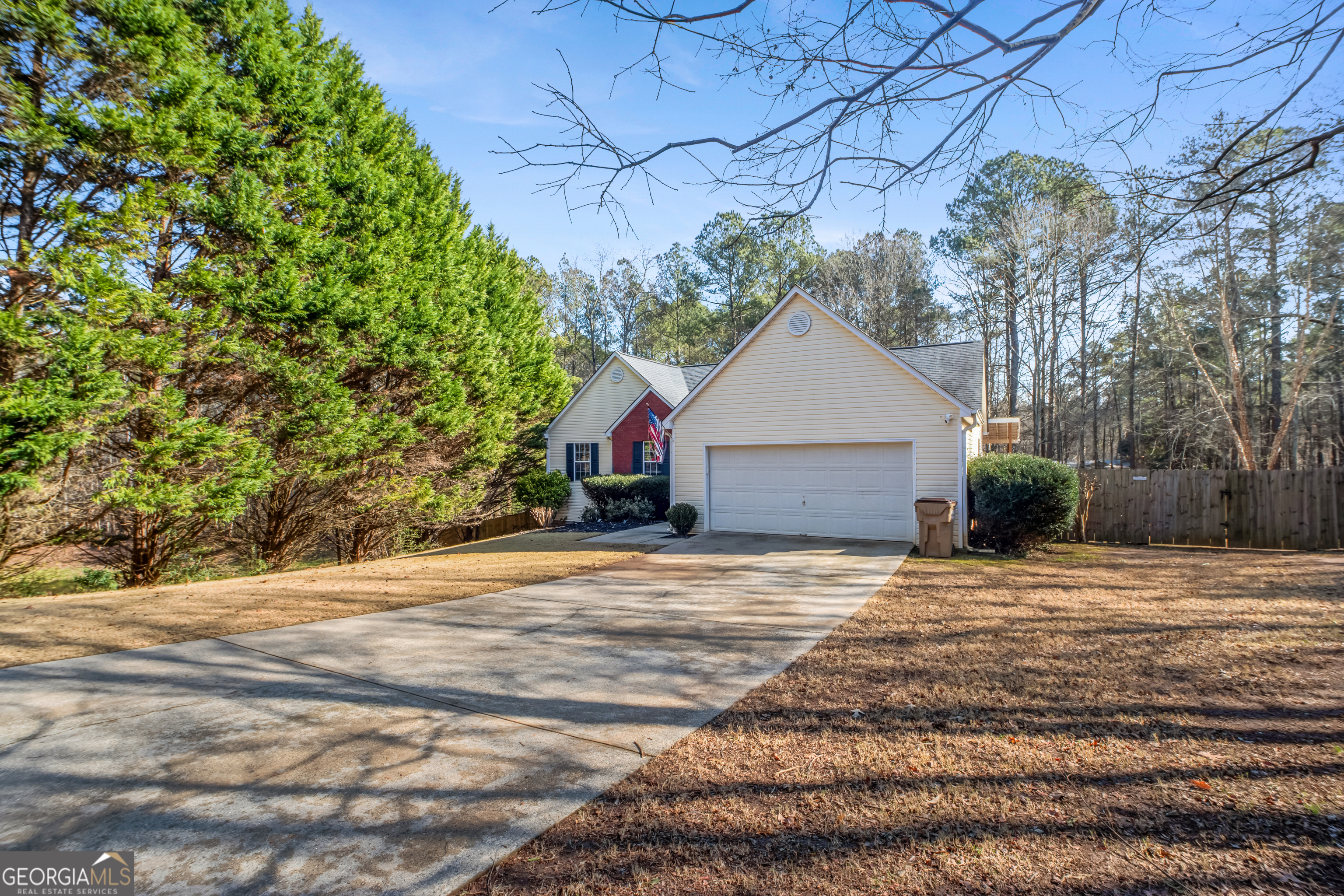 953 Azalea Court Winder, GA 30680 - Photo 40 of 56 a front view of a house with a yard and garage