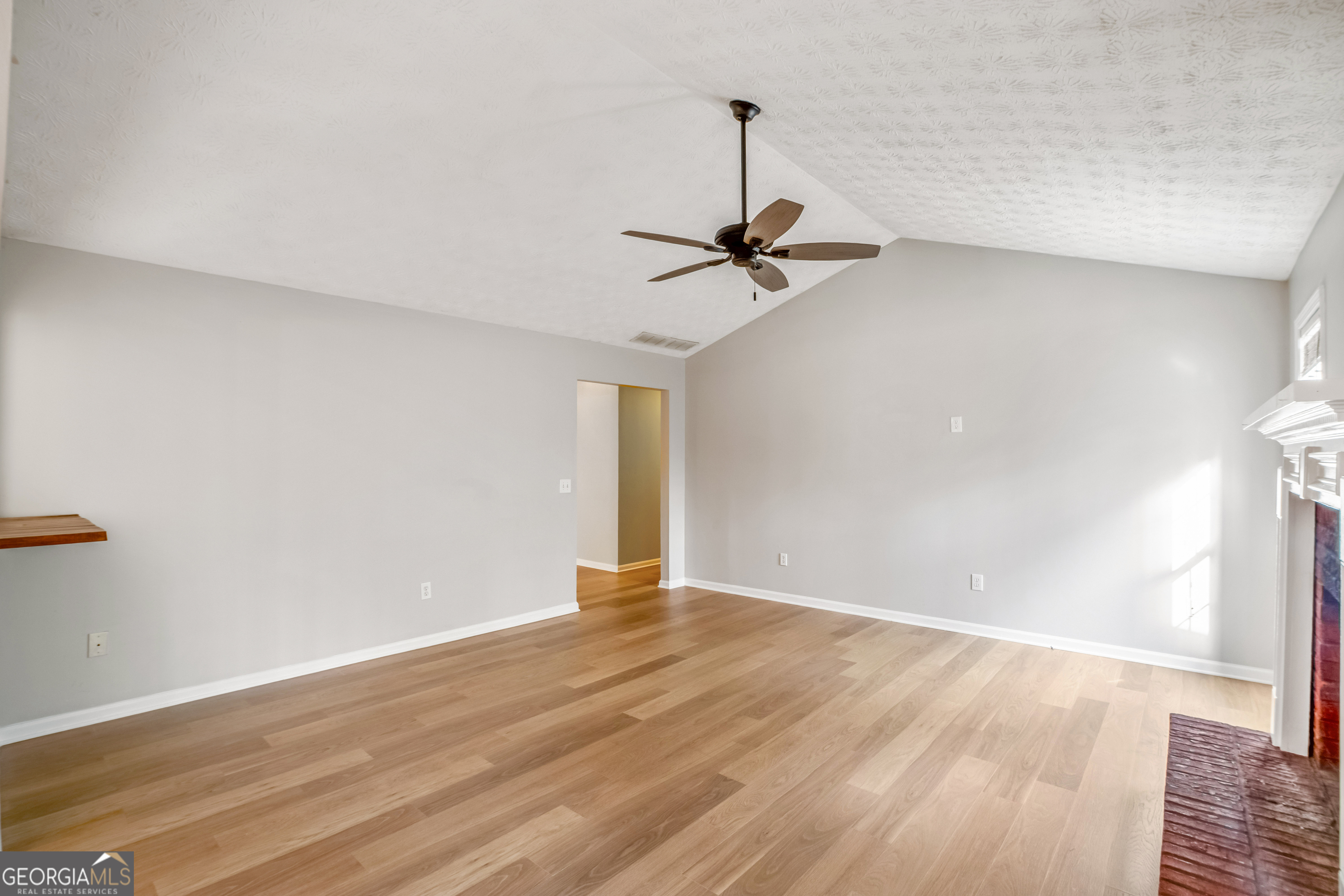 953 Azalea Court Winder, GA 30680 - Photo 5 of 56 a view of empty room with wooden floor
