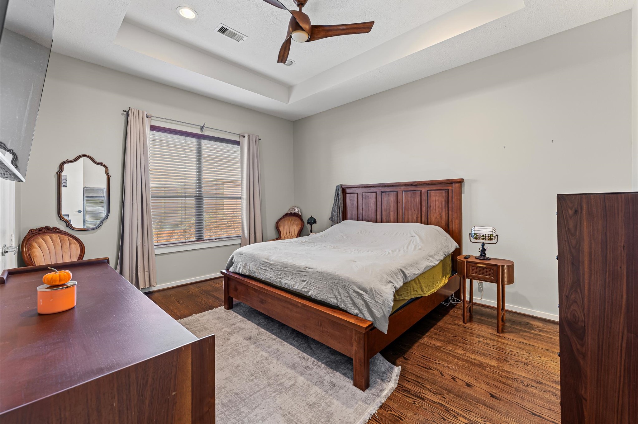 1166 Bonner Street Houston, TX 77007 - Photo 16 of 33 a bed sitting in a room next to a window