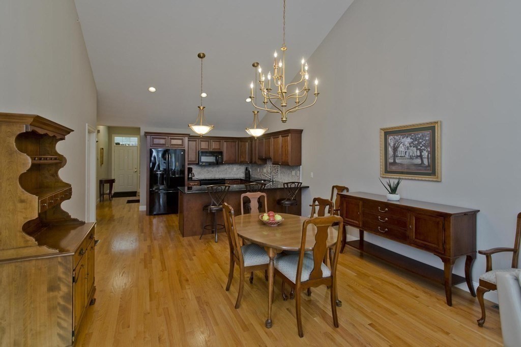 73 Beech Hill Road, Unit 73 West Springfield, MA 01089 - Photo 7 of 29 a view of a dining room with furniture and a chandelier