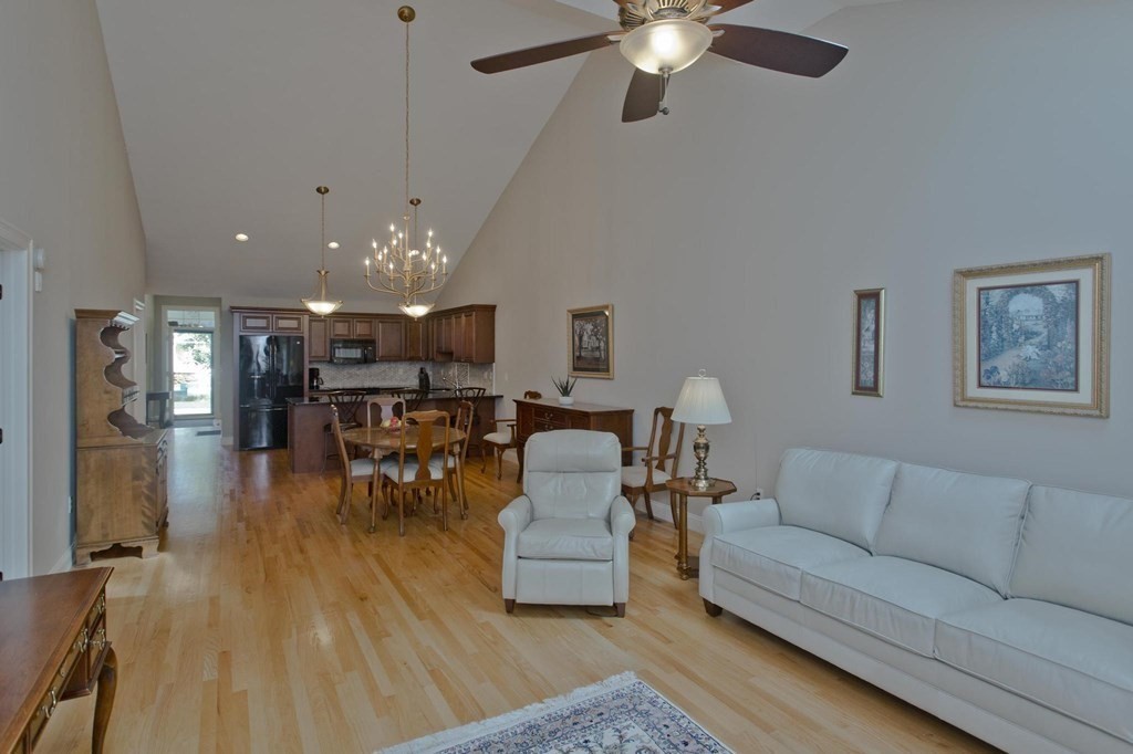 73 Beech Hill Road, Unit 73 West Springfield, MA 01089 - Photo 9 of 29 a living room with furniture and kitchen view