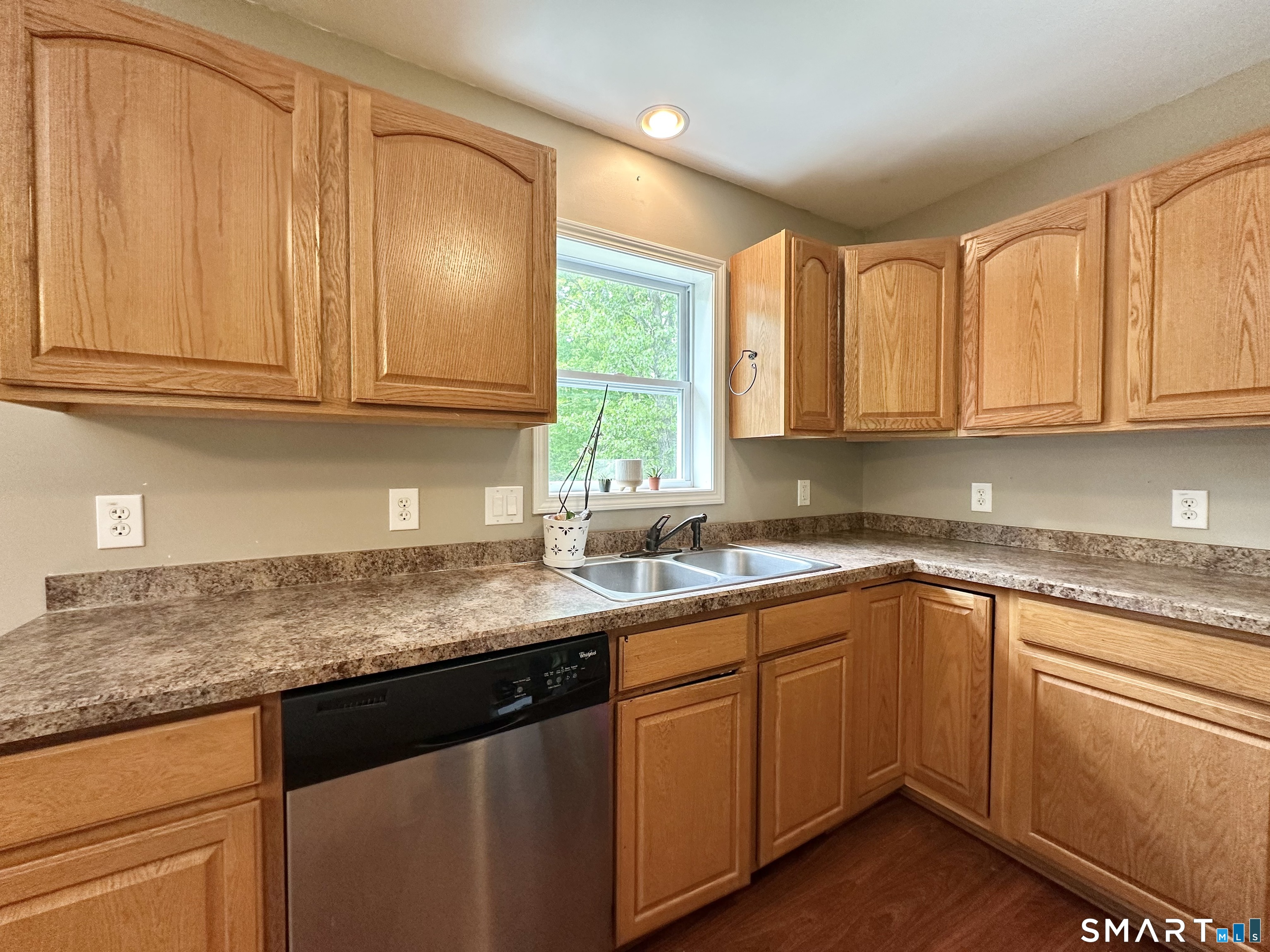 116 Tatnic Hill Road Brooklyn, CT 06234 - Photo 20 of 27 a kitchen with granite countertop stainless steel appliances granite countertop a sink window and cabinets