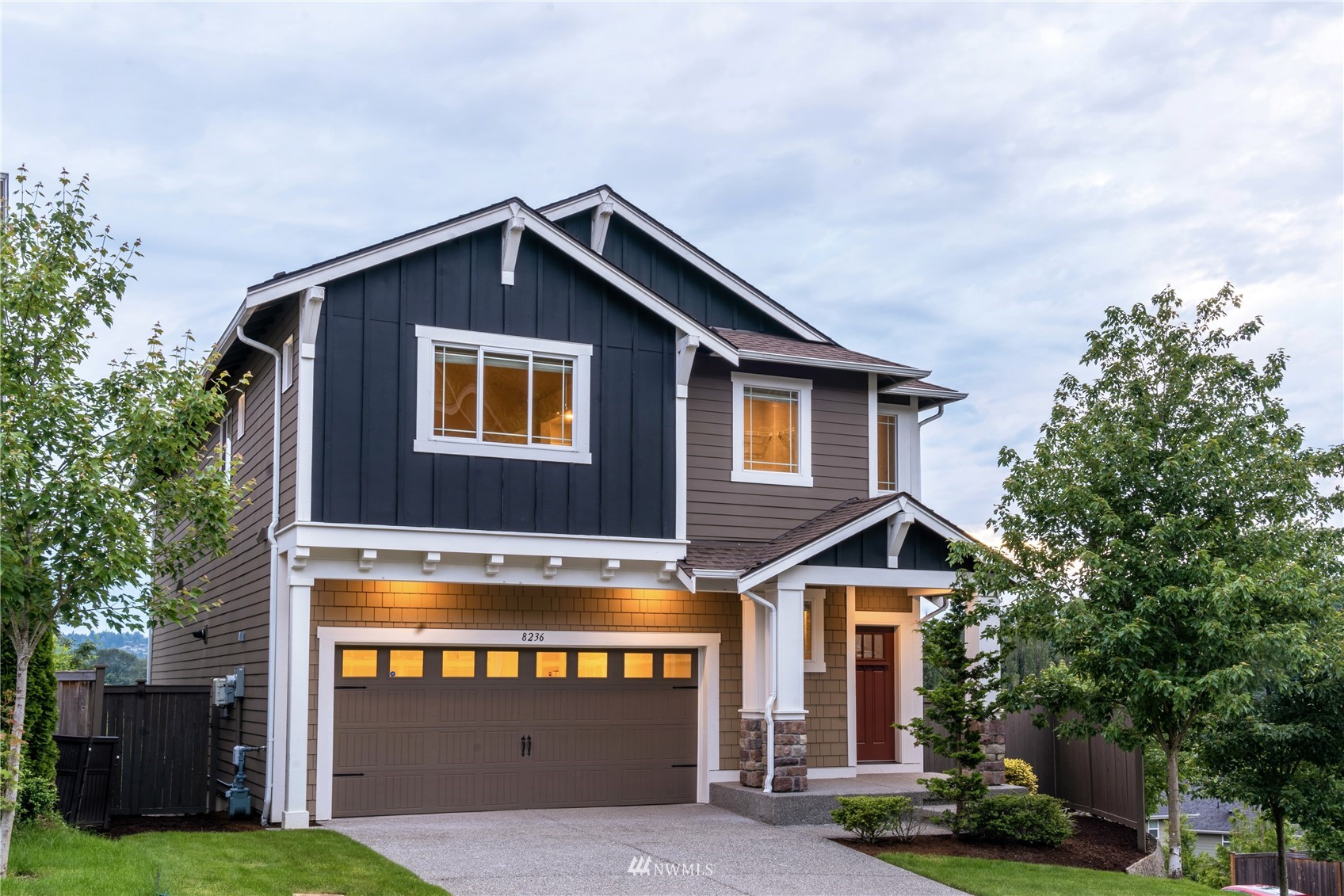 a front view of a house with yard