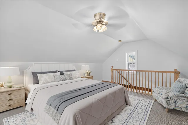 a bedroom with bed and a window