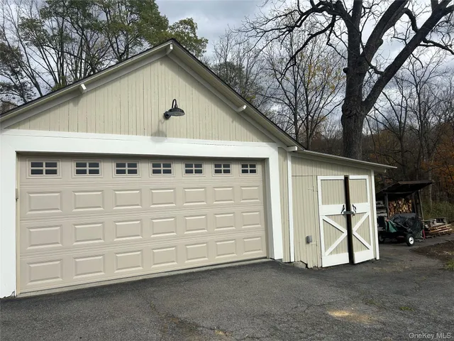 a view of backyard with garage