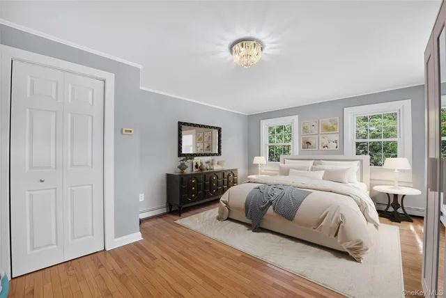 a bedroom with a bed and a tv