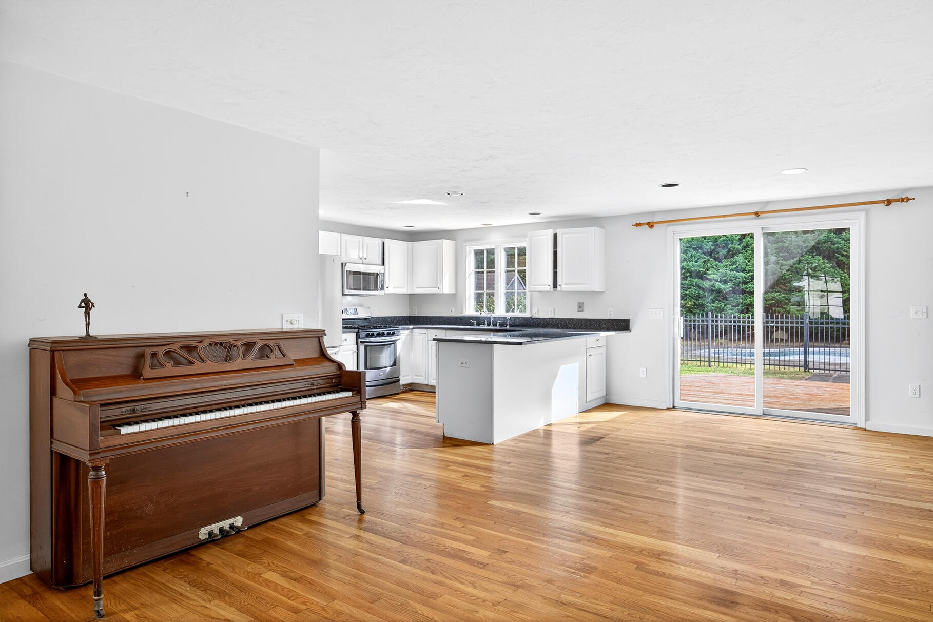 30 Fox Crossing Road Brewster, MA 02631 - Photo 11 of 36 a kitchen with granite countertop a stove and a sink