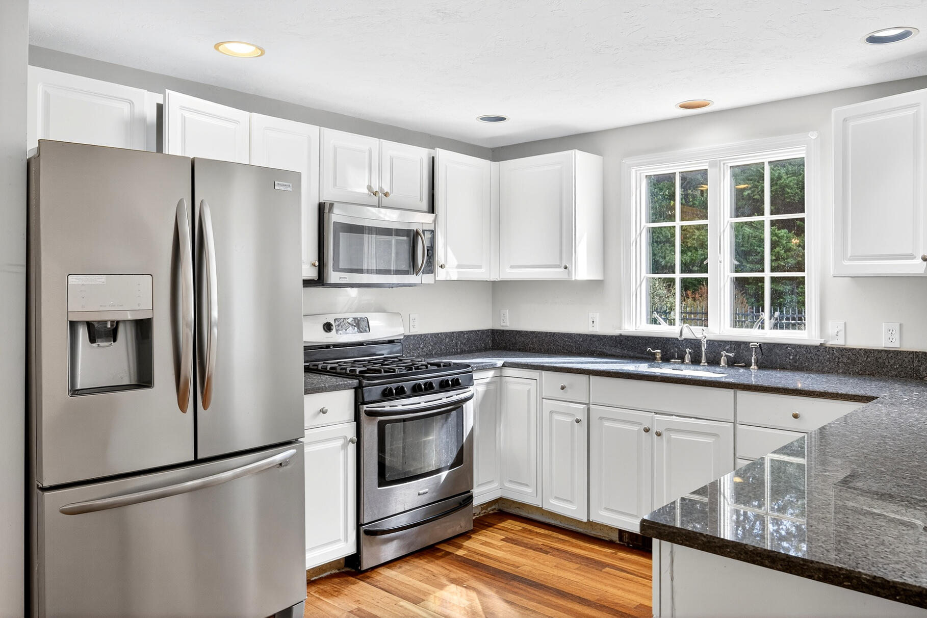 30 Fox Crossing Road Brewster, MA 02631 - Photo 13 of 36 a kitchen with stainless steel appliances granite countertop a refrigerator sink and stove