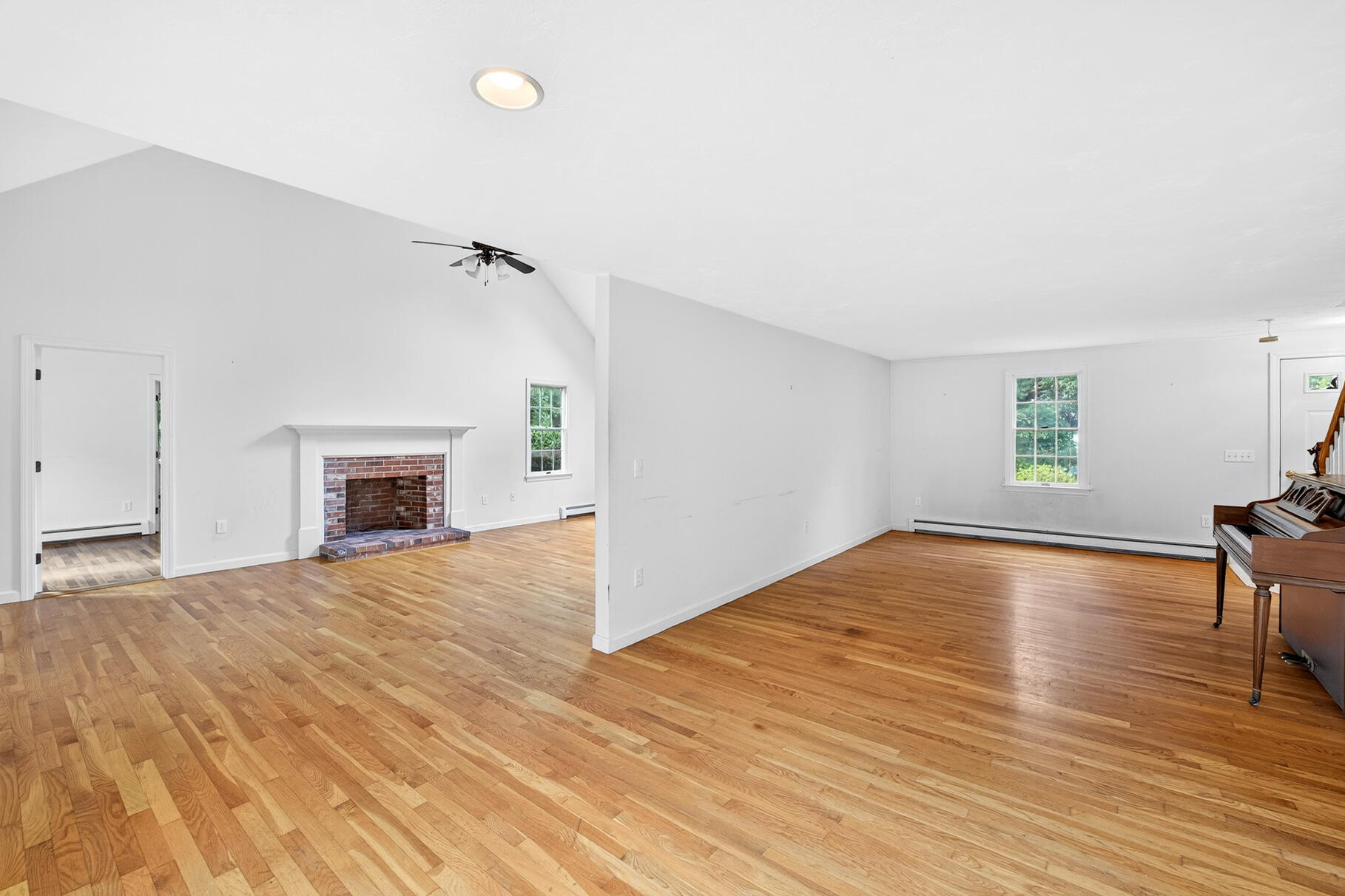 30 Fox Crossing Road Brewster, MA 02631 - Photo 15 of 36 a view of empty room with wooden floor and fireplace