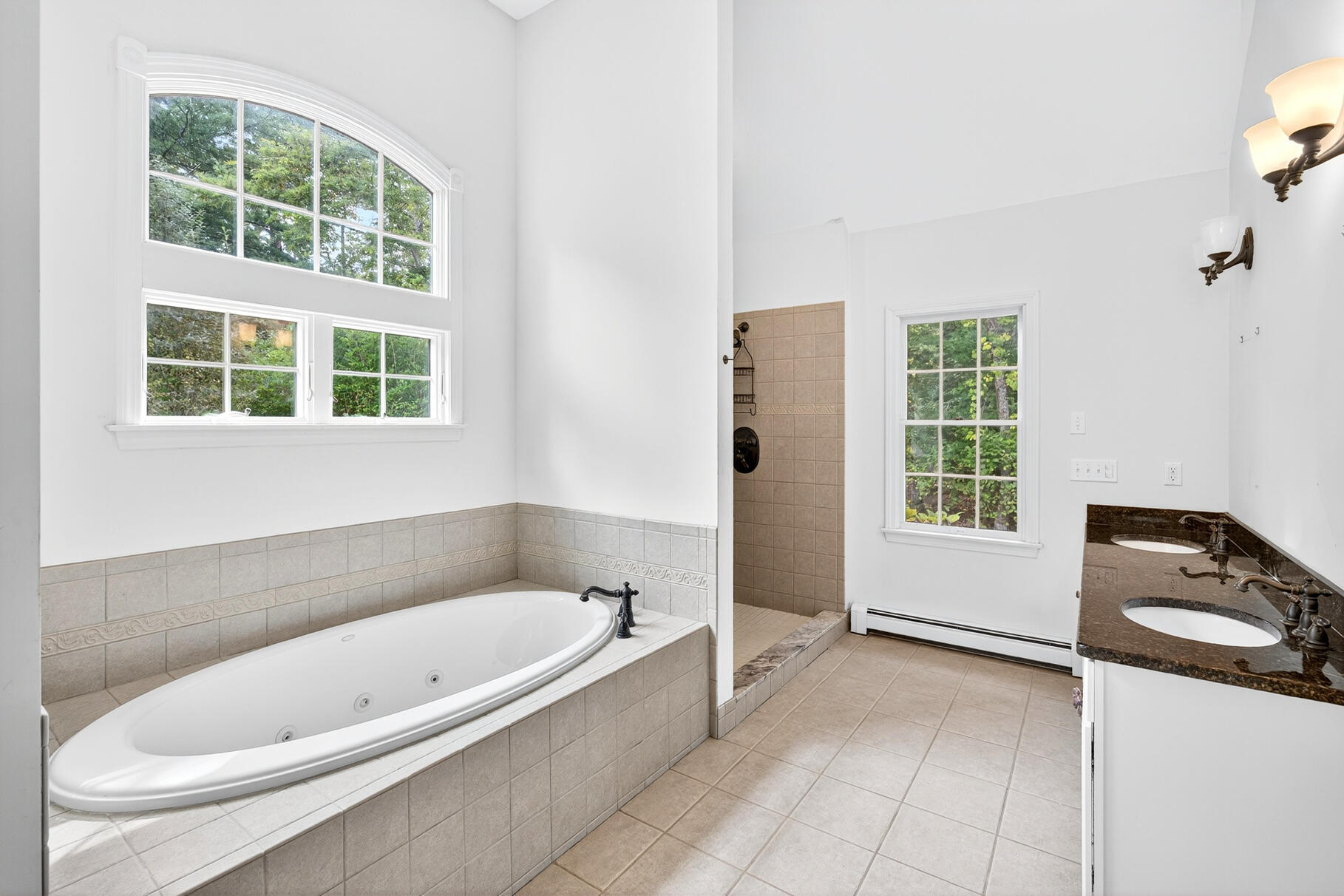 30 Fox Crossing Road Brewster, MA 02631 - Photo 20 of 36 a bathroom with a tub a sink and a window