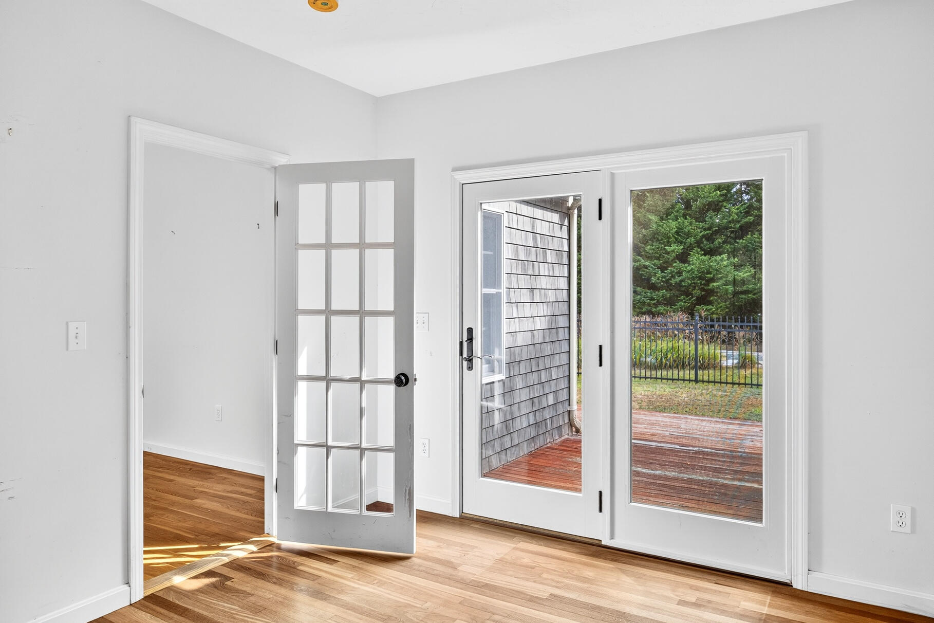 30 Fox Crossing Road Brewster, MA 02631 - Photo 22 of 36 a view of an empty room with wooden floor and a window