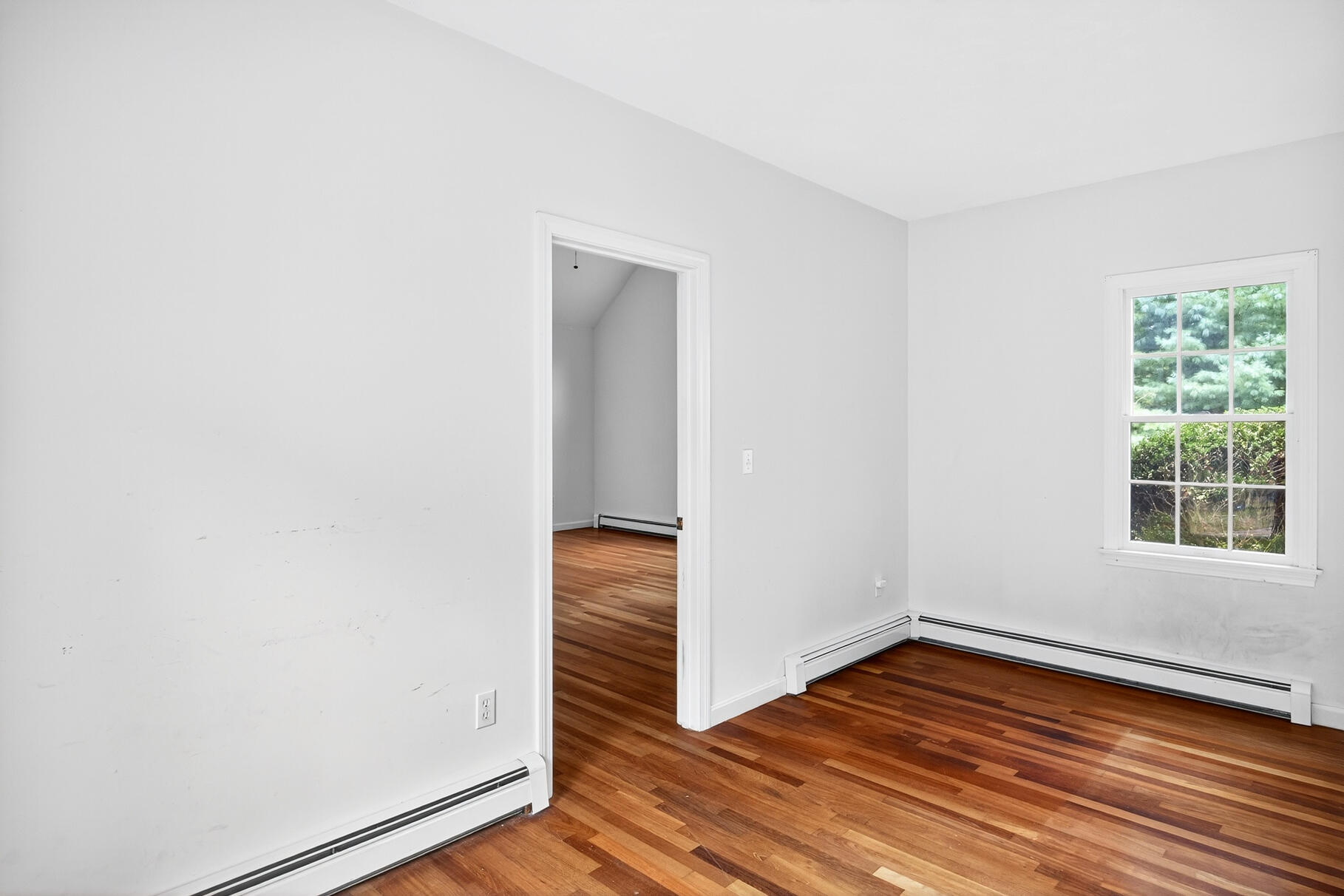30 Fox Crossing Road Brewster, MA 02631 - Photo 24 of 36 an empty room with wooden floor and windows
