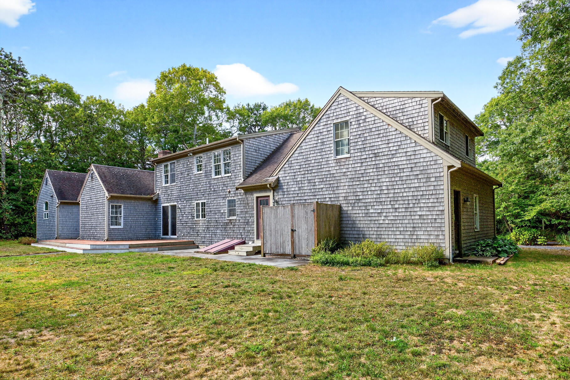 30 Fox Crossing Road Brewster, MA 02631 - Photo 7 of 36 a view of a house with a yard and large tree