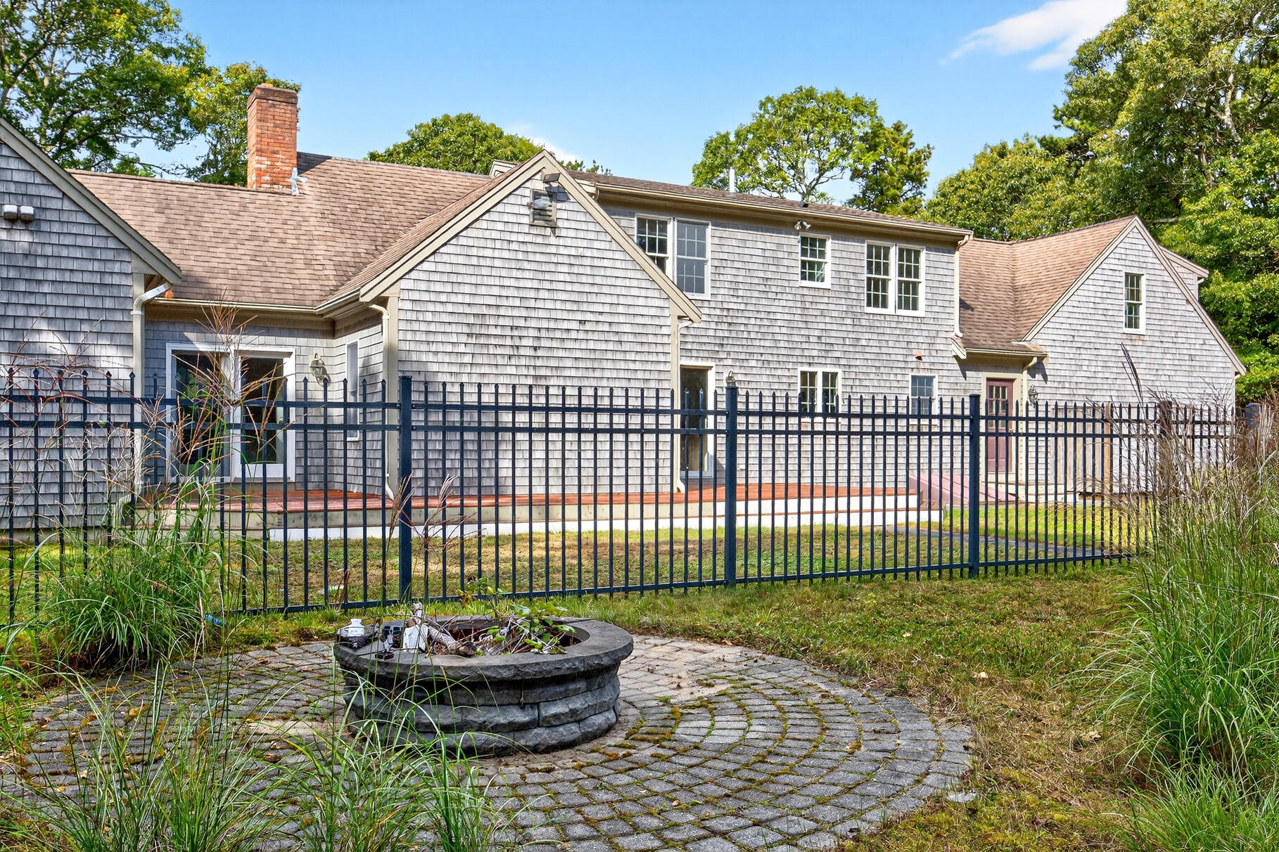 30 Fox Crossing Road Brewster, MA 02631 - Photo 9 of 36 a view of a house with a backyard
